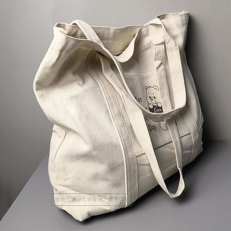 （出口--含棉量高好货）时尚卡通带插袋大容量单肩包帆布包购物袋