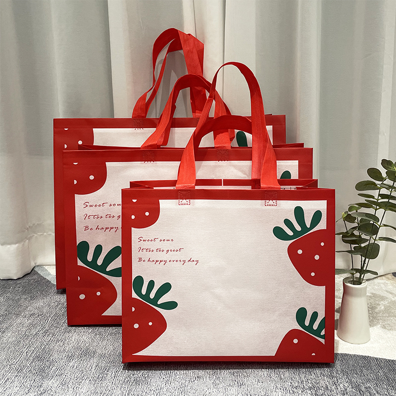 新年红色草莓手提袋子童装无纺布袋服装店可爱包装袋水果礼物袋
