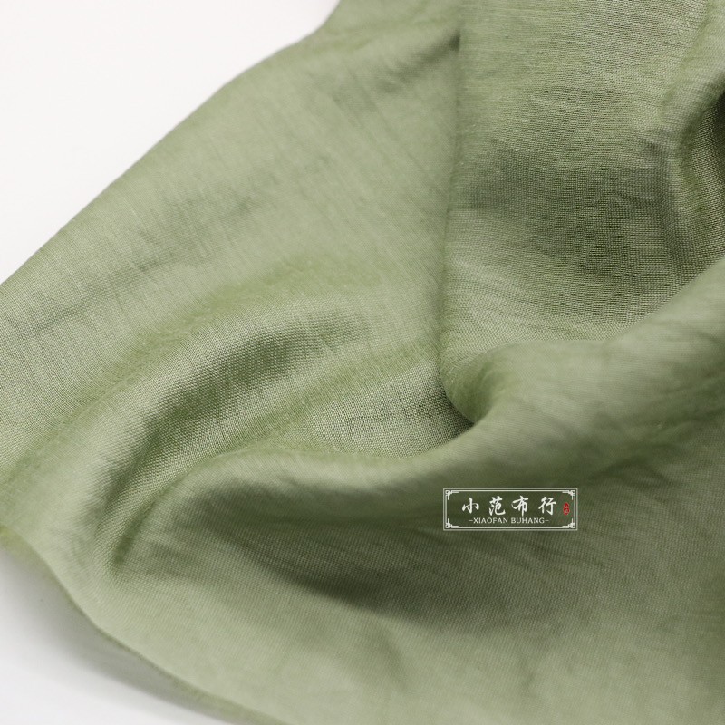 果绿色丝光棉天丝棉布料 光泽感飘逸透气夏季服装面料 设计师娃衣