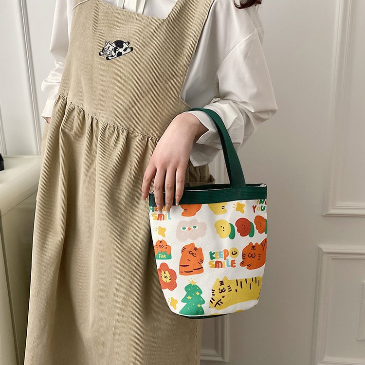 日系可爱卡通涂鸦虎少女手提水桶包包女印花帆布包学生圆筒便当包